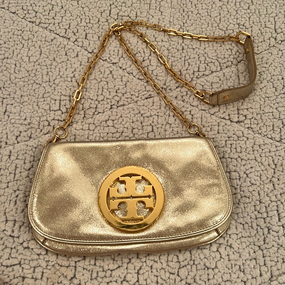 tory burch saddle bag with gold medallion